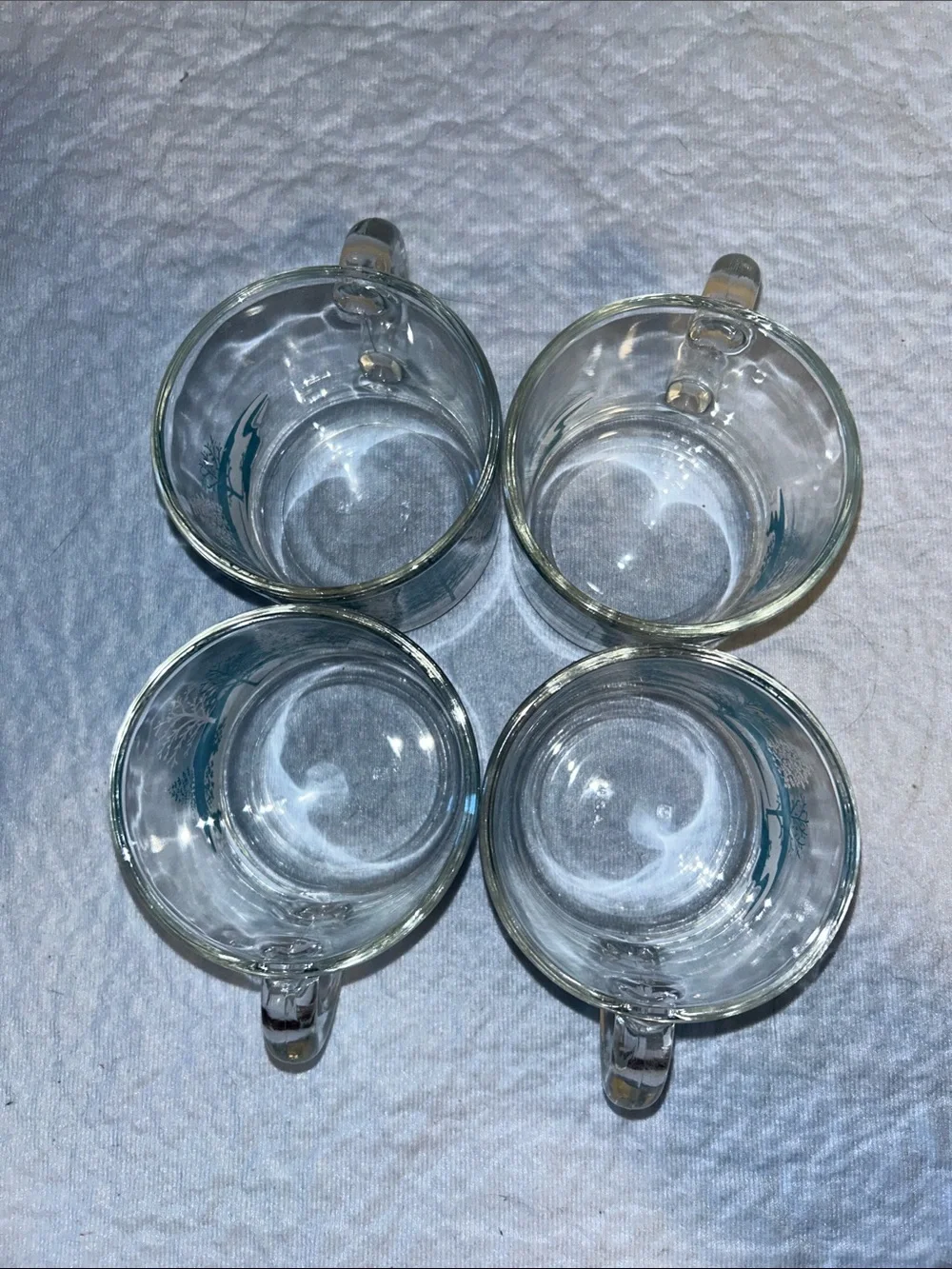 Set of 4Anchor Hocking clear glass coffee mugs featuring a blue-and-white winter